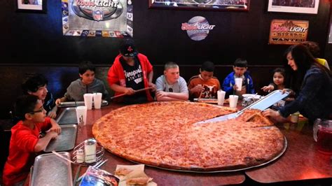 Big Lous Pizza, a San Antonio institution, makes a bigger pizza than you could ever possibly dream of a 42-inch diameter pie. . Big lous pizza photos